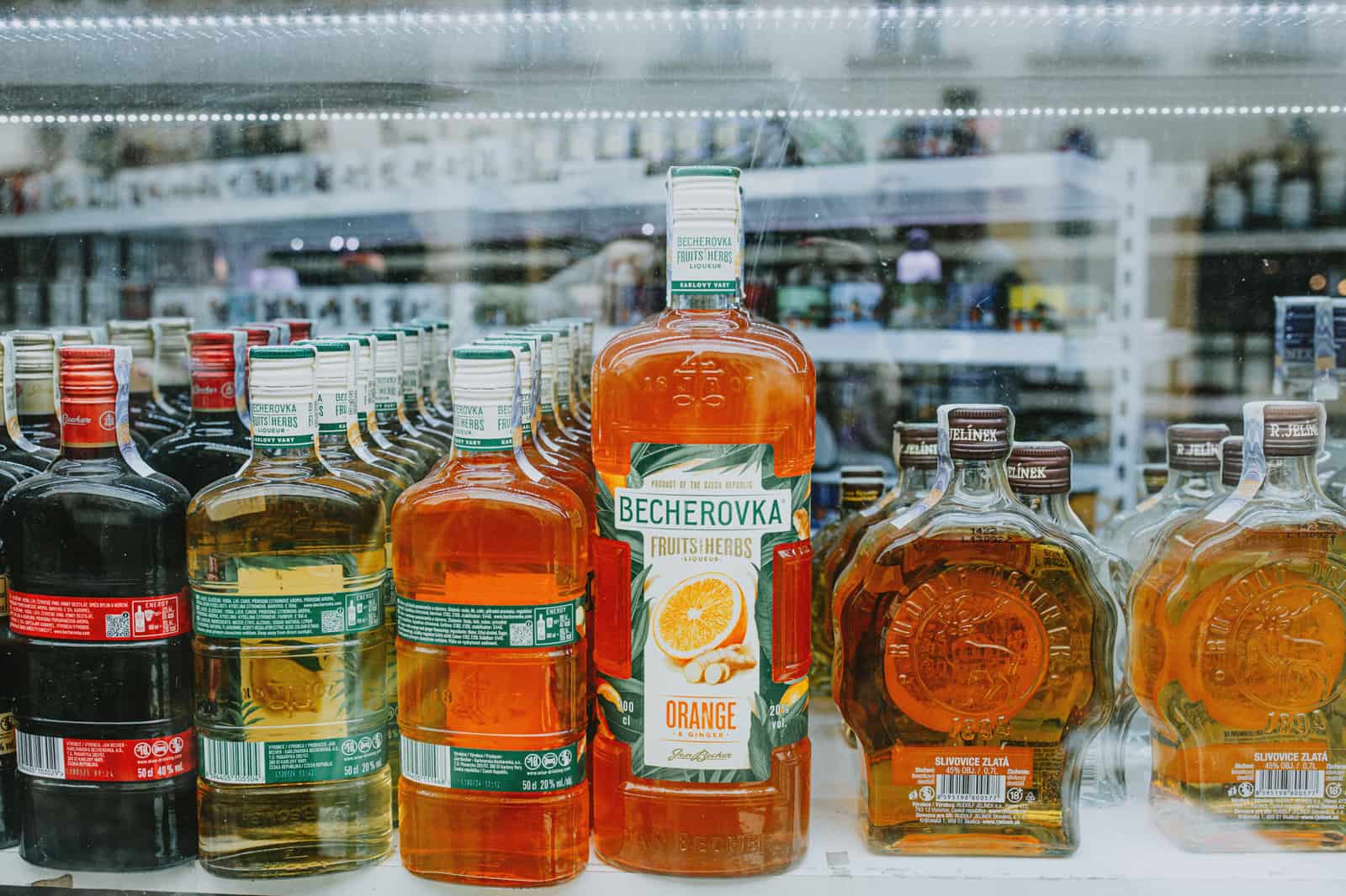 Spirit bottles on a bright shelf in daylight