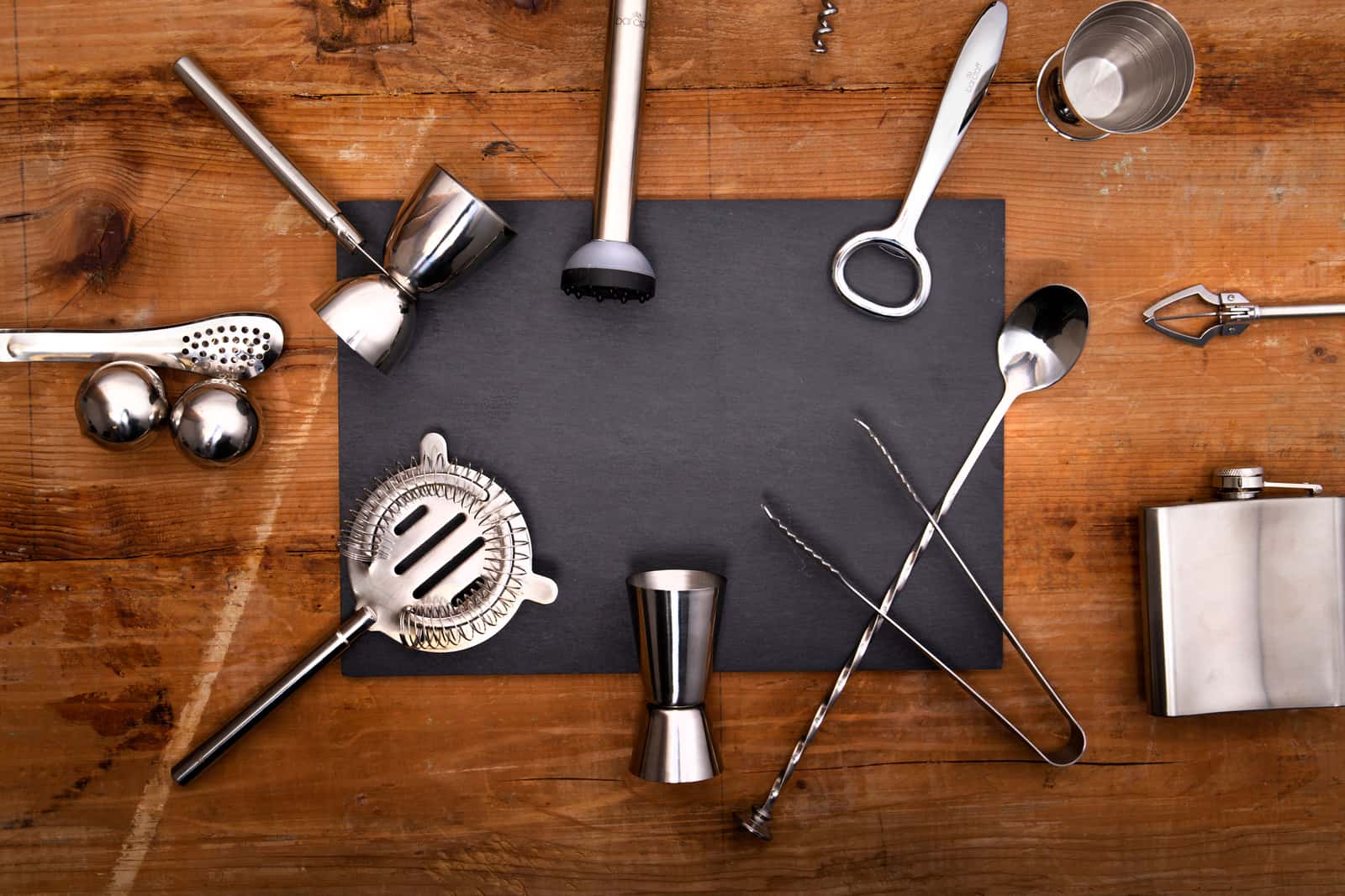 Bartender tools laid out on a bright surface