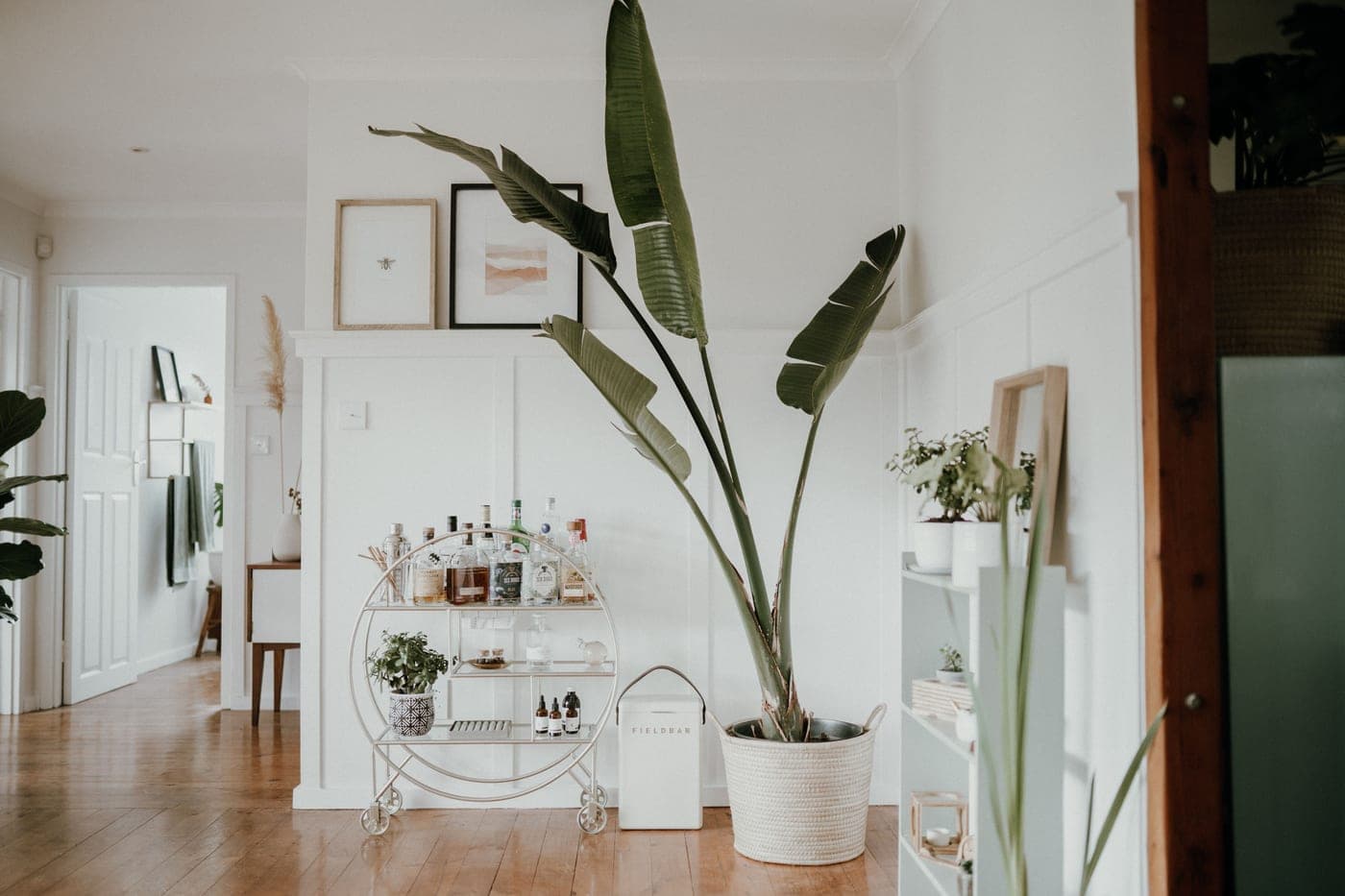 A bar cart in a bright living room interior